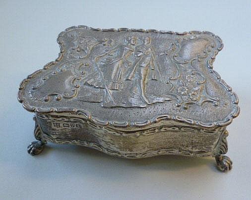 A silver hinge lidded trinket box, of shaped