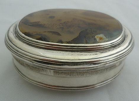 A silver mounted oval hinge lidded snuff box, the