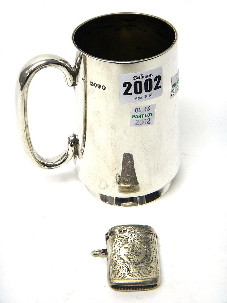 A Victorian silver mug, of tapering cylindrical form, with a 'C' shaped han