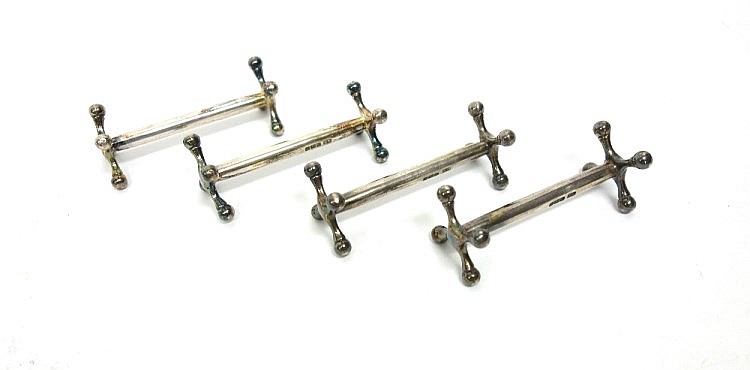 A Victorian set of four silver knife rests, Sheffield 1899, weight 229 gms.