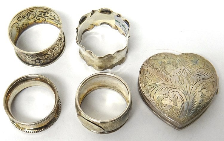 A silver napkin ring, having a shaped rim, Sheffield 1908, three further si