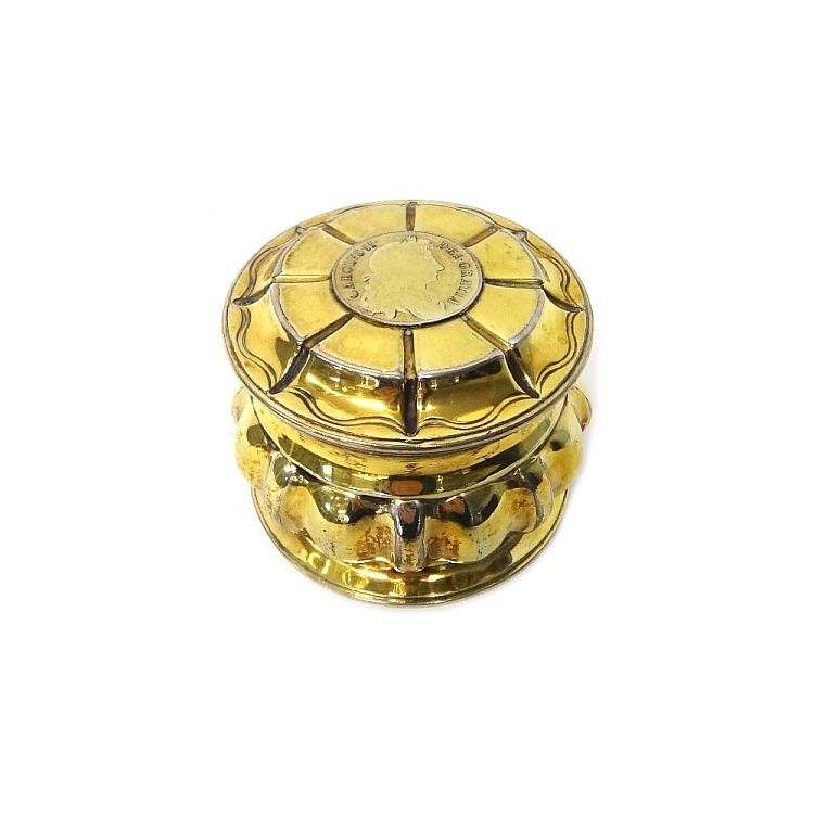 A Victorian silver gilt hinge lidded circular box, the body with lobed deco