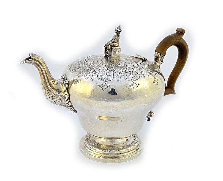 A William IV silver teapot, of inverted pear shaped form, decorated with bo