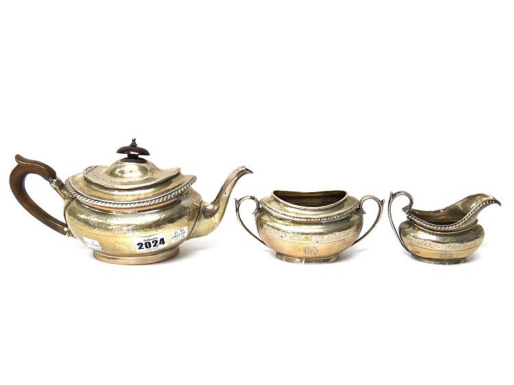A Victorian silver composite three piece tea set, comprising; a teapot, Lon