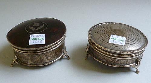 A silver circular hinge lidded trinket box, the