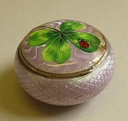 An enameled hinge lidded circular trinket box, the
