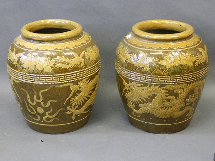 A pair of Chinese glazed earthenware floor vases with...