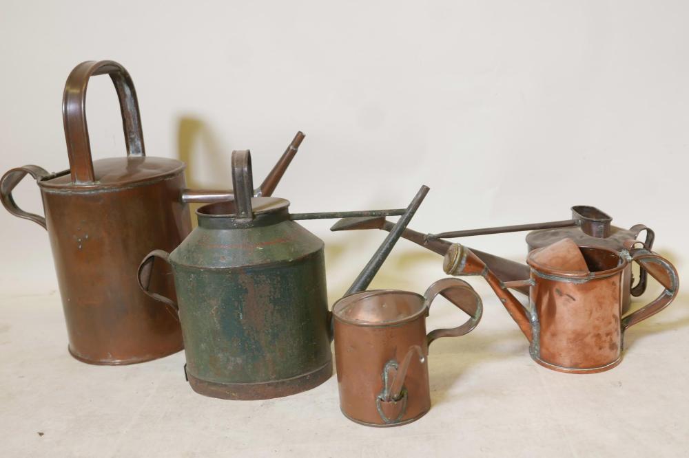 A vintage copper watering can