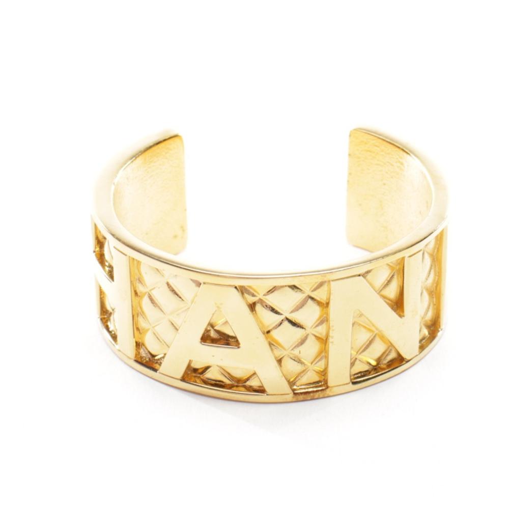 CHANEL - Rigid cuff bracelet.