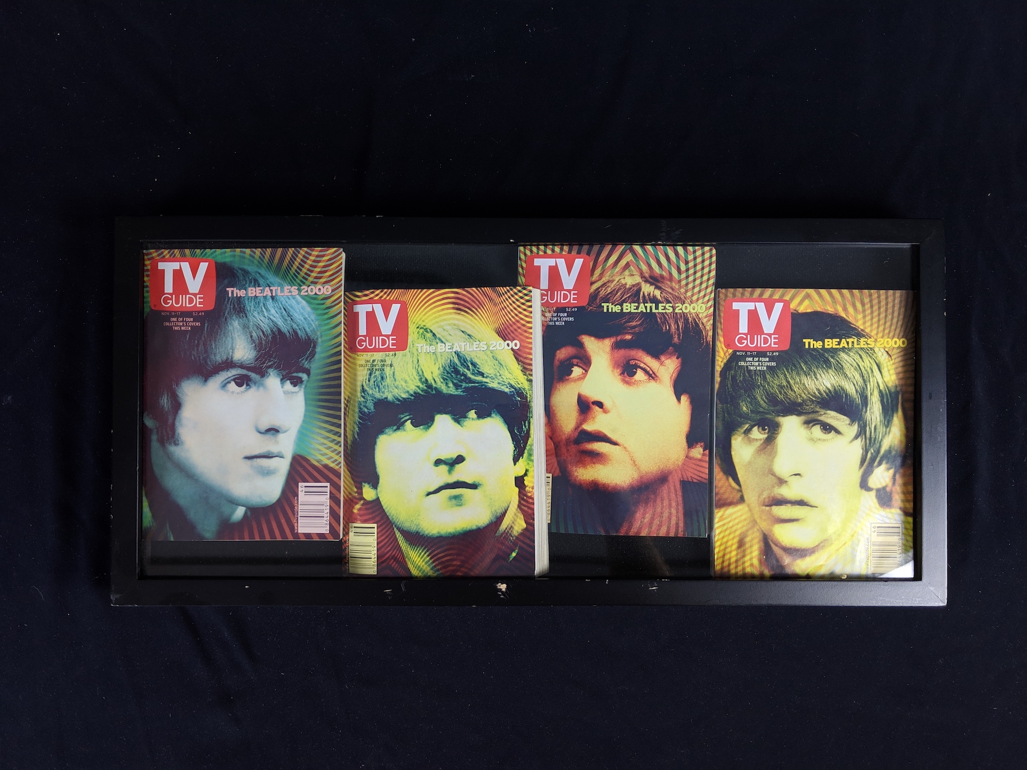 3 Shadow Boxes with TV Guide, books signed by Cynthia Lennon, Ringo Drumsticks.