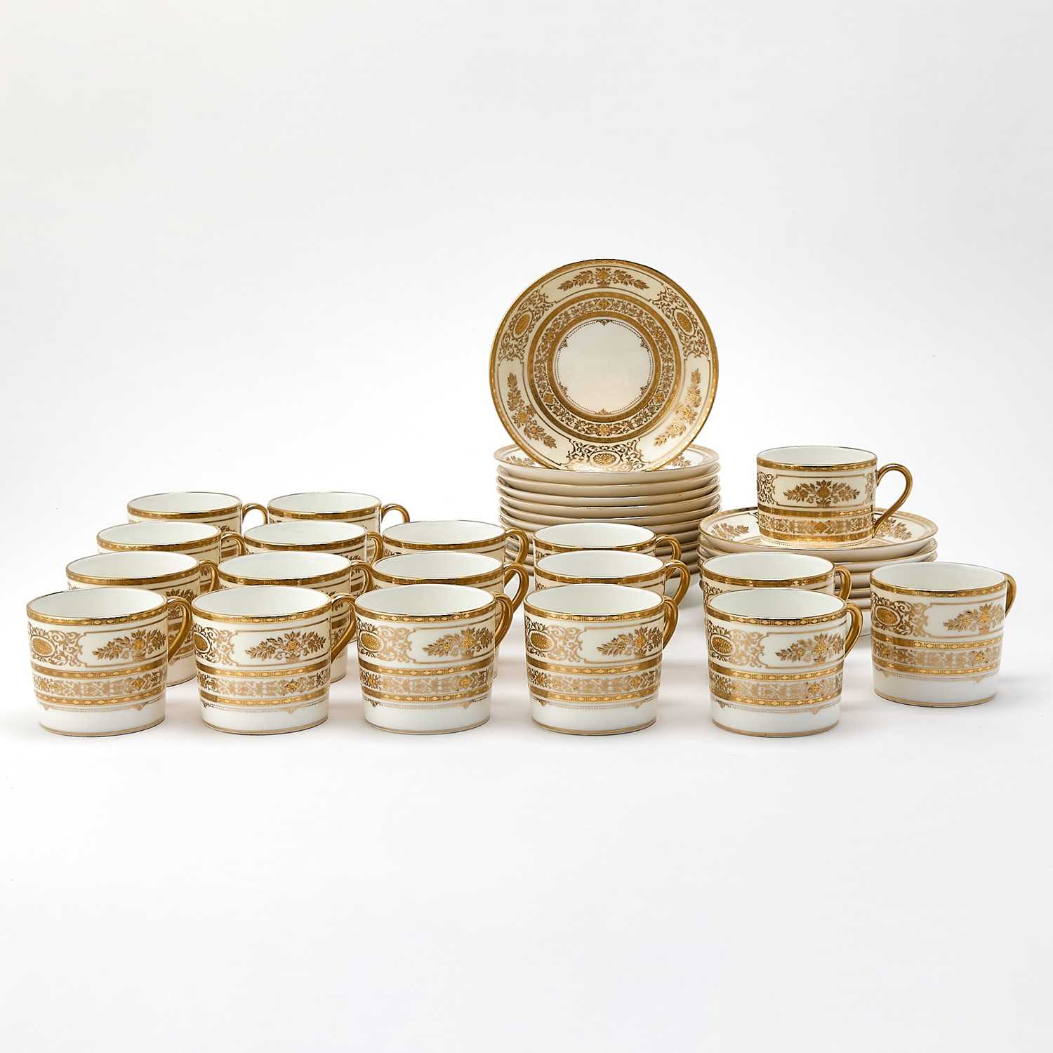 Set of Eighteen Minton Gilt Decorated Porcelain Demitasse Cups and Saucers