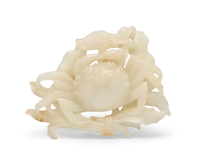 A Chinese white jade reticulated 'crab and grain' brush...