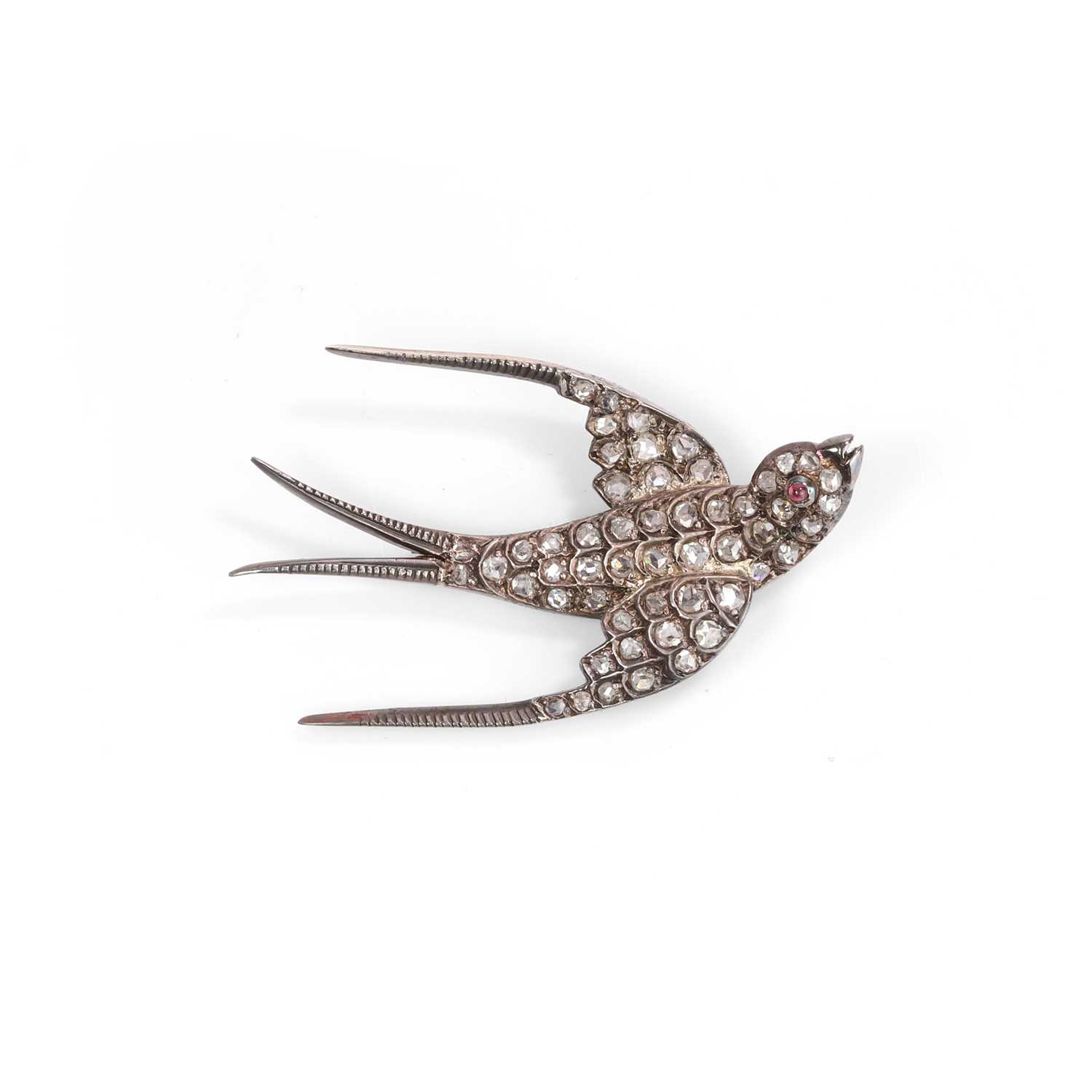A diamond swallow brooch