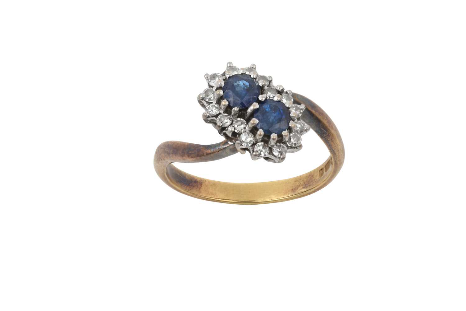 An 18 Carat Sapphire and Diamond Double Cluster Ring