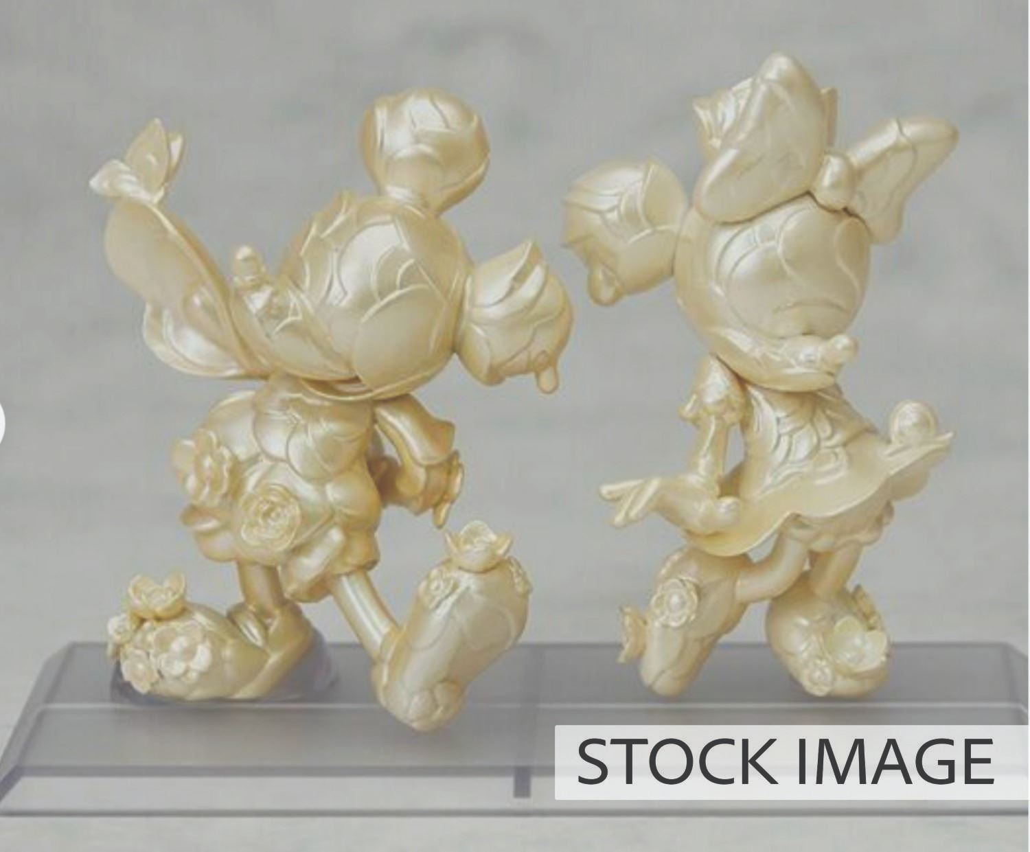 A D23 Mickey & Minnie Mouse 90th Anniversary Figurine Set.