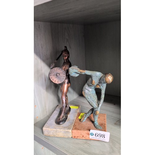 Two contemporary metal figural sculptures—one a copper-toned...