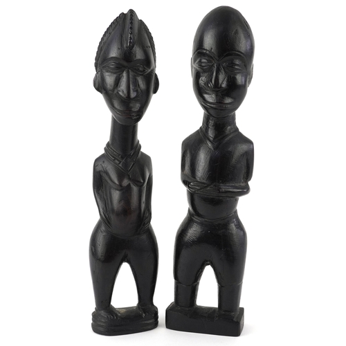 African carved wood tribal fertility figure and a similar ca...
