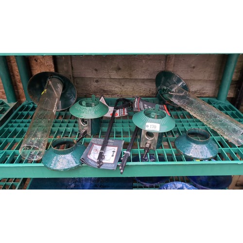 A quantity of outdoor bird-feeding accessories, including tw...
