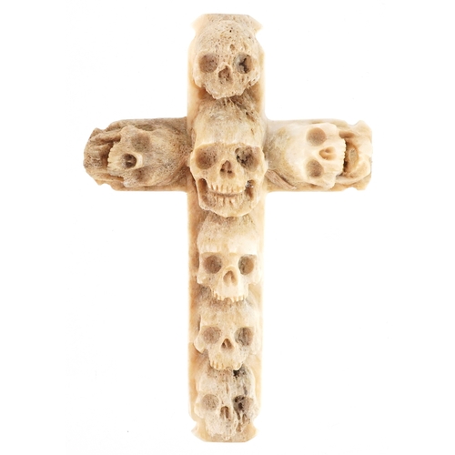 Carved bone human skull design cross, 8cm high, 9.4g.